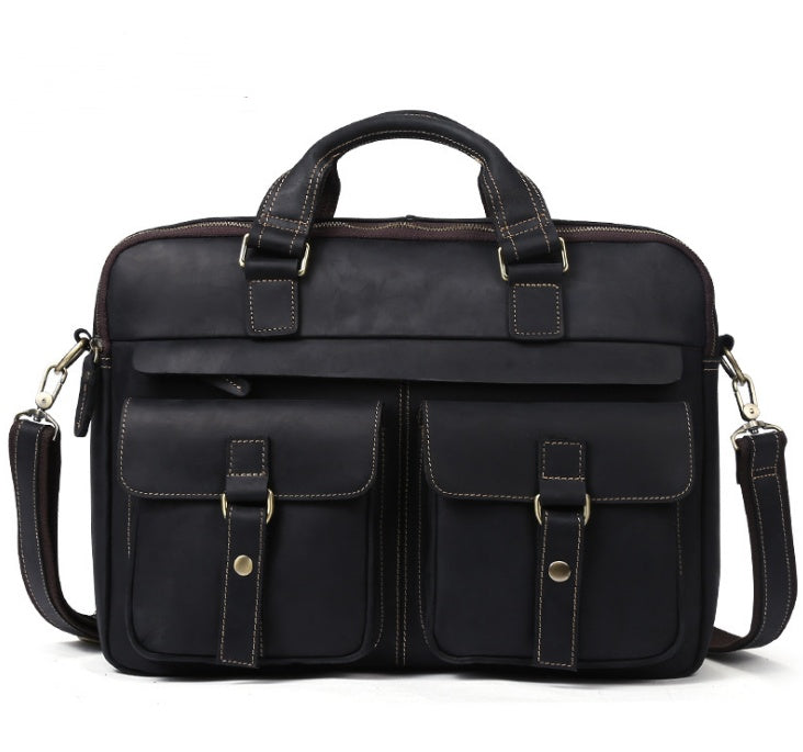Black leather briefcase with multiple pockets and straps on a white background