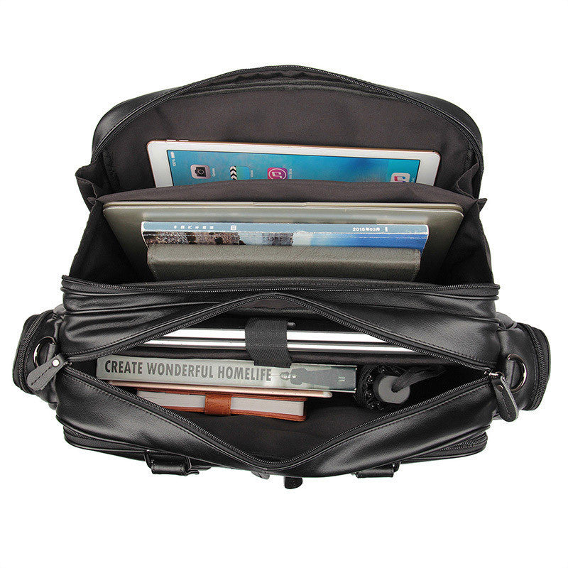 Black backpack with compartments holding electronic devices on a white background