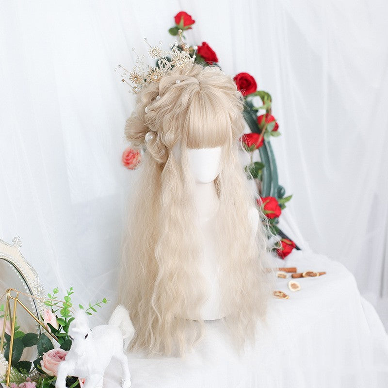Blonde wig on a mannequin head with decorative flowers and a white background