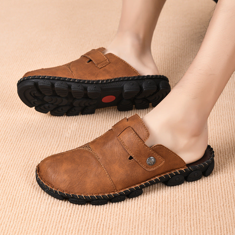 Brown leather slippers worn by a person on a beige background