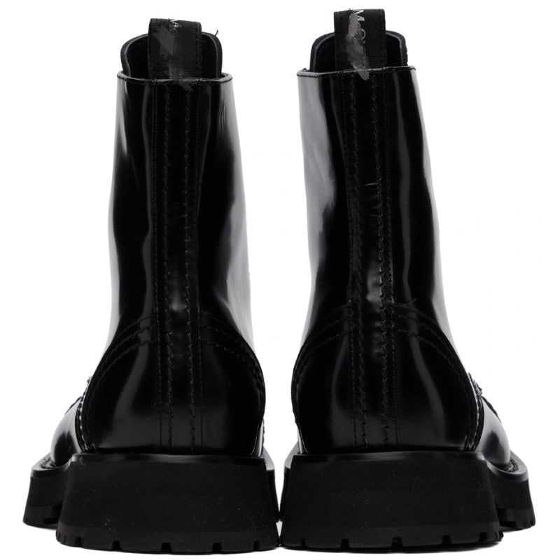Black glossy boots on a white background