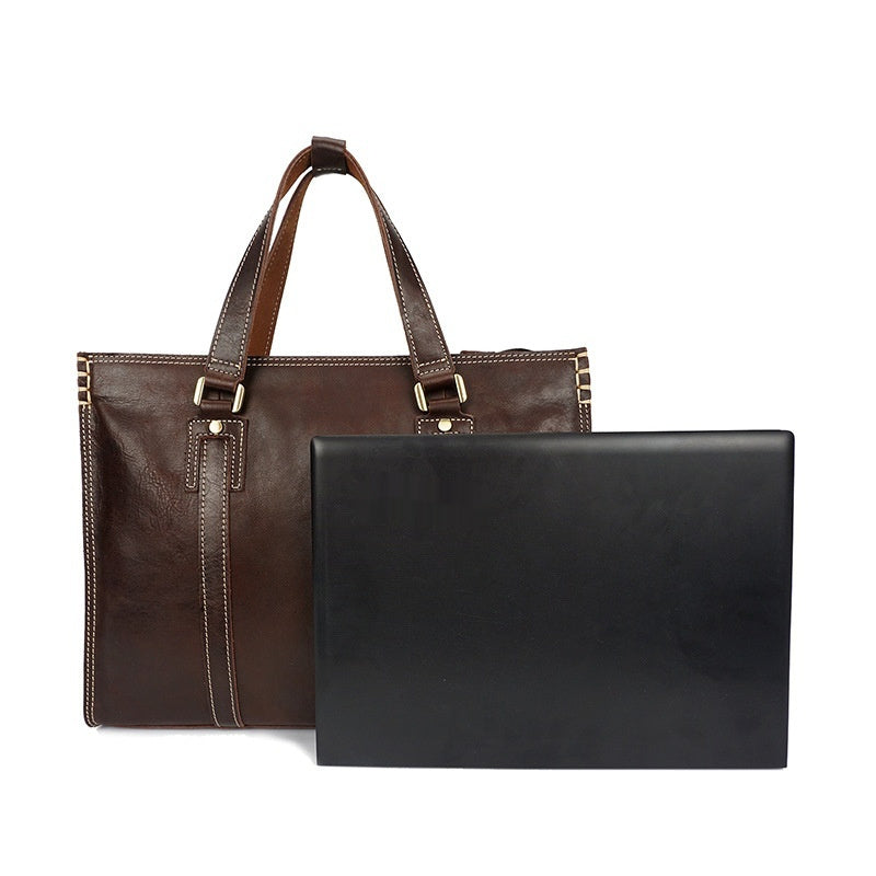 Brown leather briefcase and black leather folder on a white background