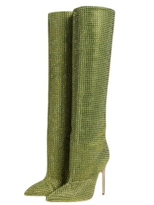 Green knee-high boots with a textured pattern on a white background