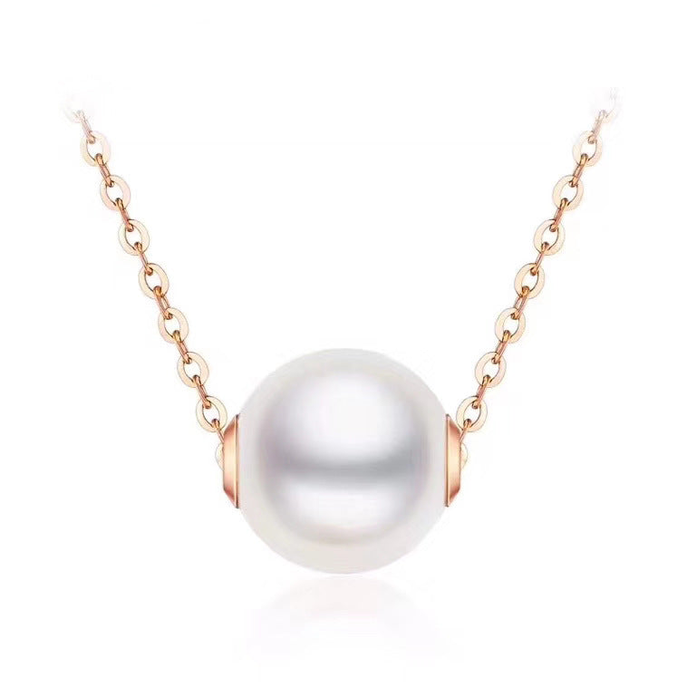 Pearl necklace with rose gold clasp on a white background