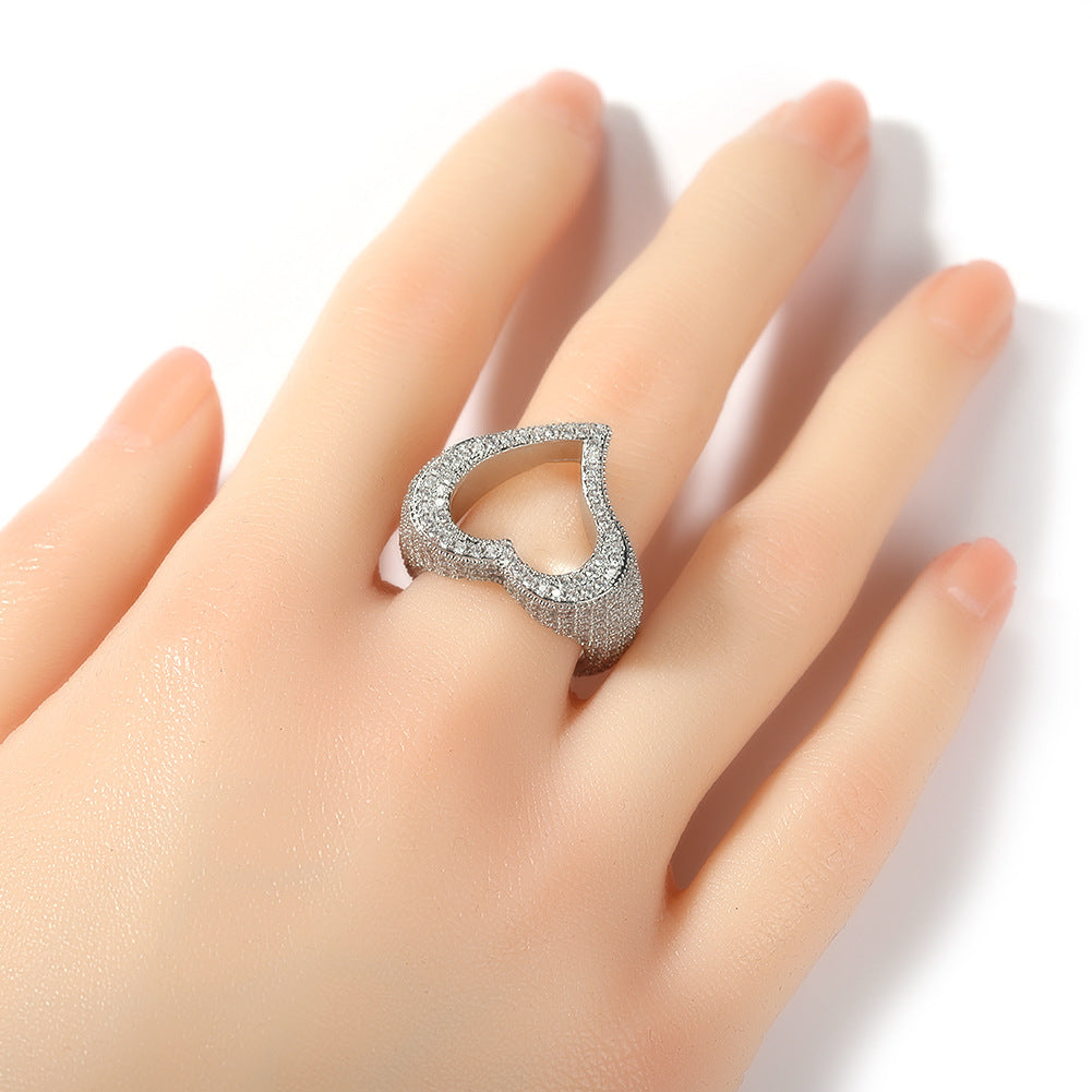 Silver ring on a hand against a white background