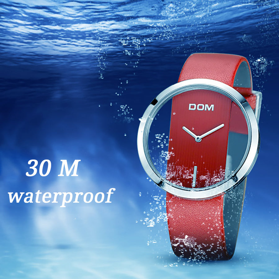 Red watch with a silver bezel on a blue underwater background, featuring the brand 'DOM'.