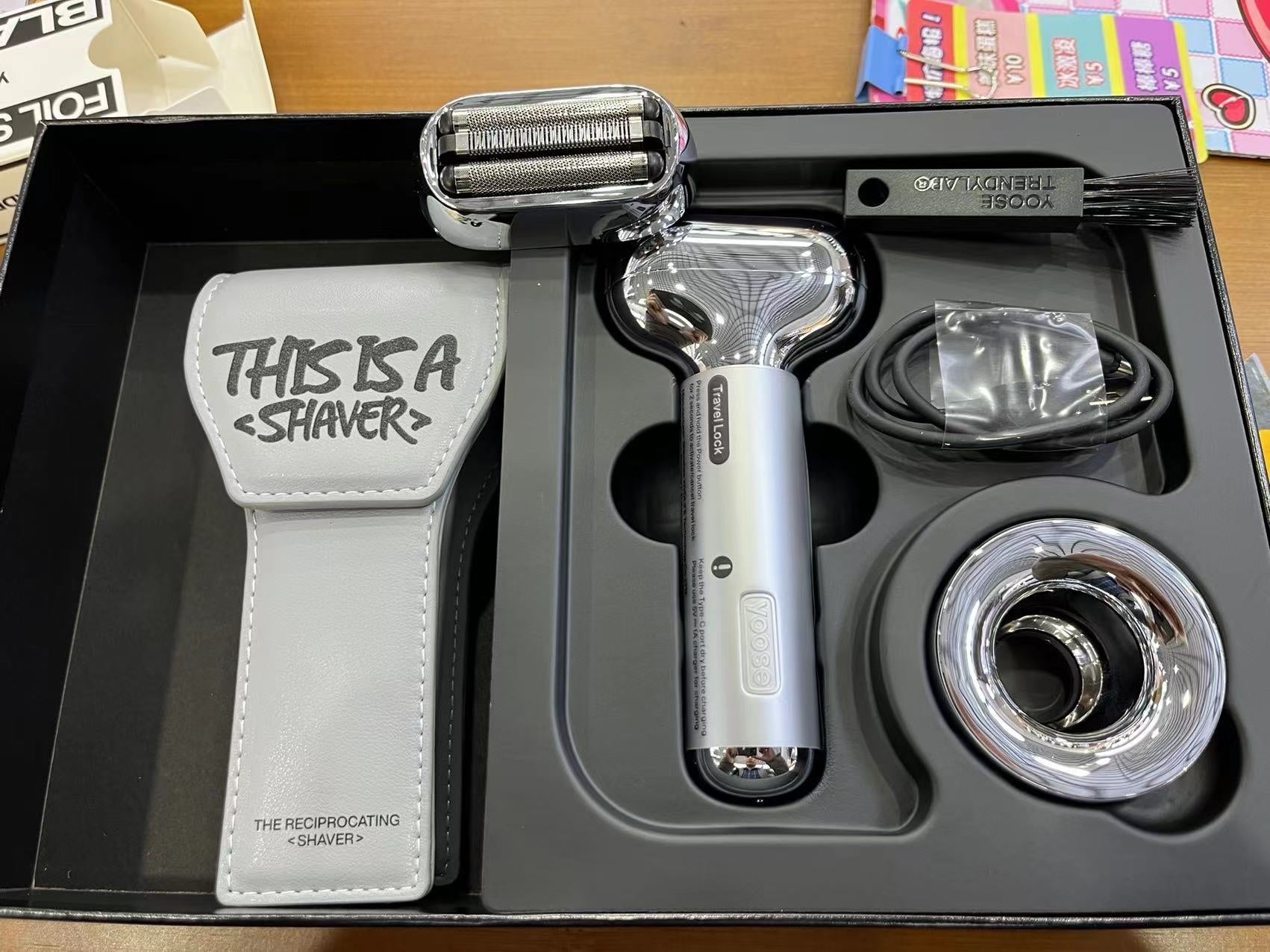 Shaver set with accessories on a black tray