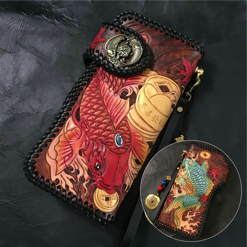 Handcrafted leather wallet with fish design on a dark background