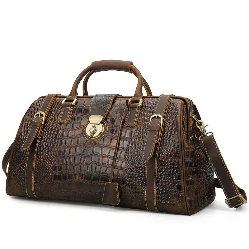 Brown leather duffel bag with embossed texture on a white background
