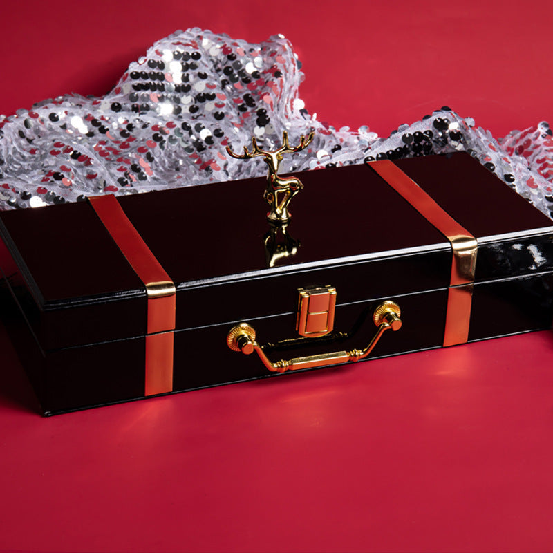 Decorative black box with gold accents on a red background