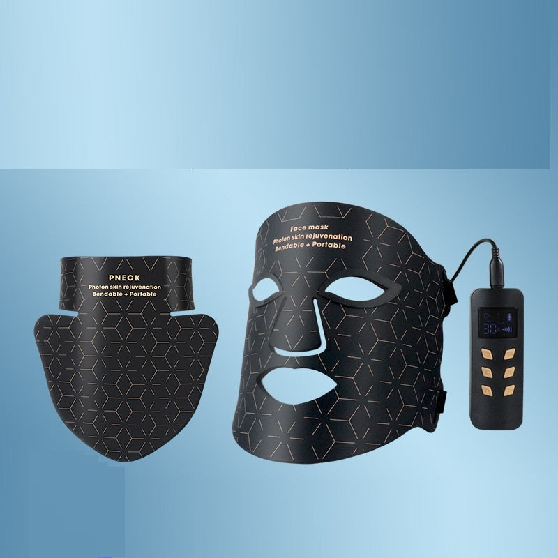 Black LED face mask with control device on a blue gradient background