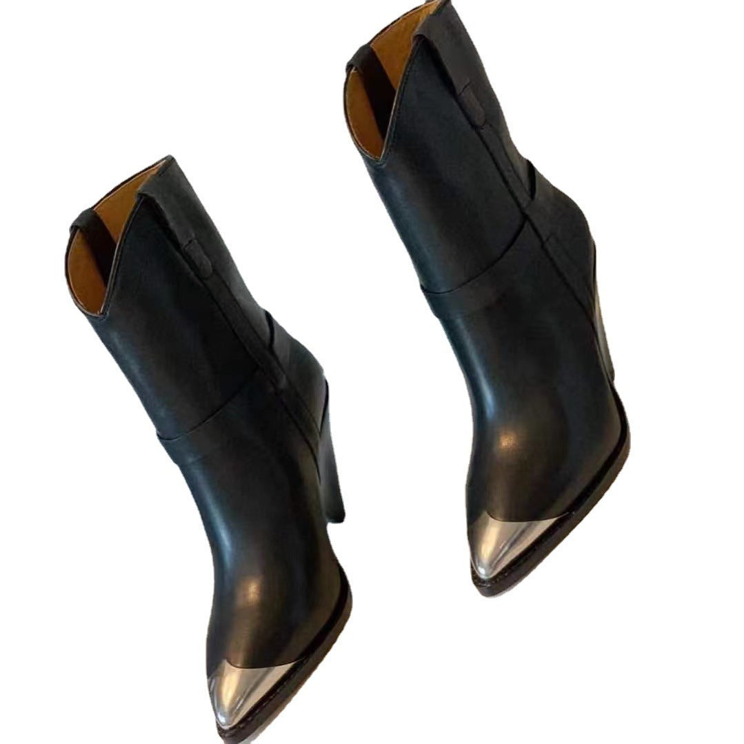 Black pointed-toe boots on a white background