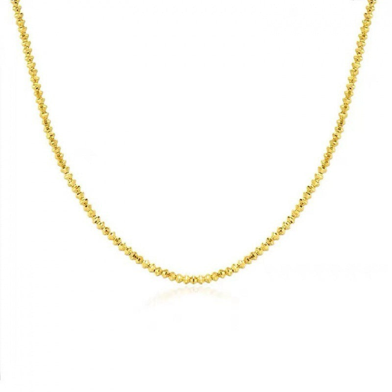 Gold chain necklace on a white background