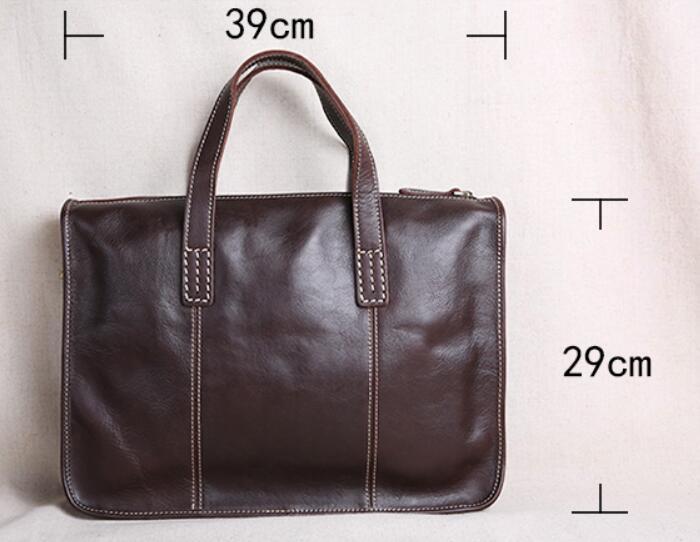 Brown leather briefcase with measurements on a light background