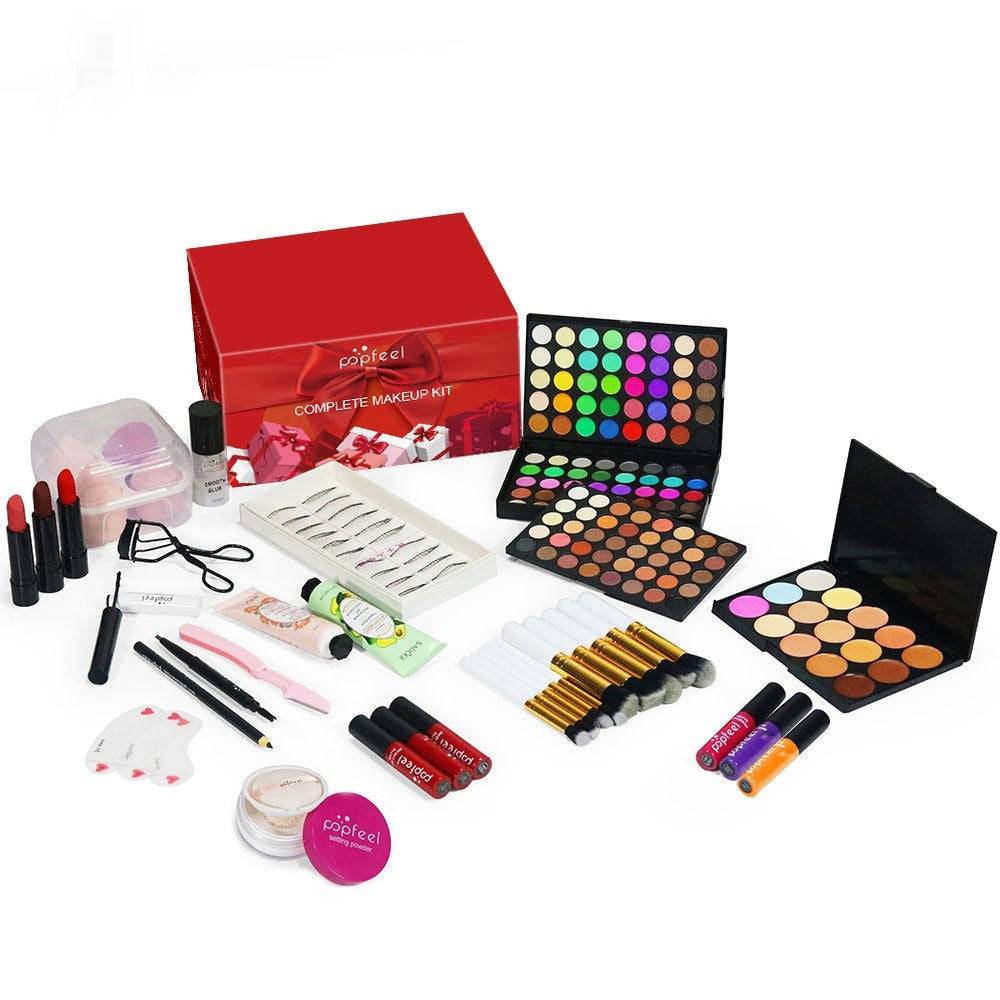 Makeup kit with various cosmetic items on a white background