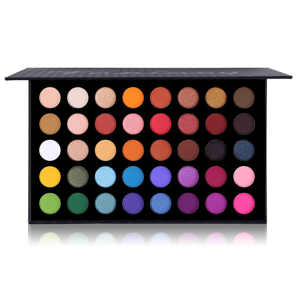 Makeup palette with a variety of colorful shades on a white background