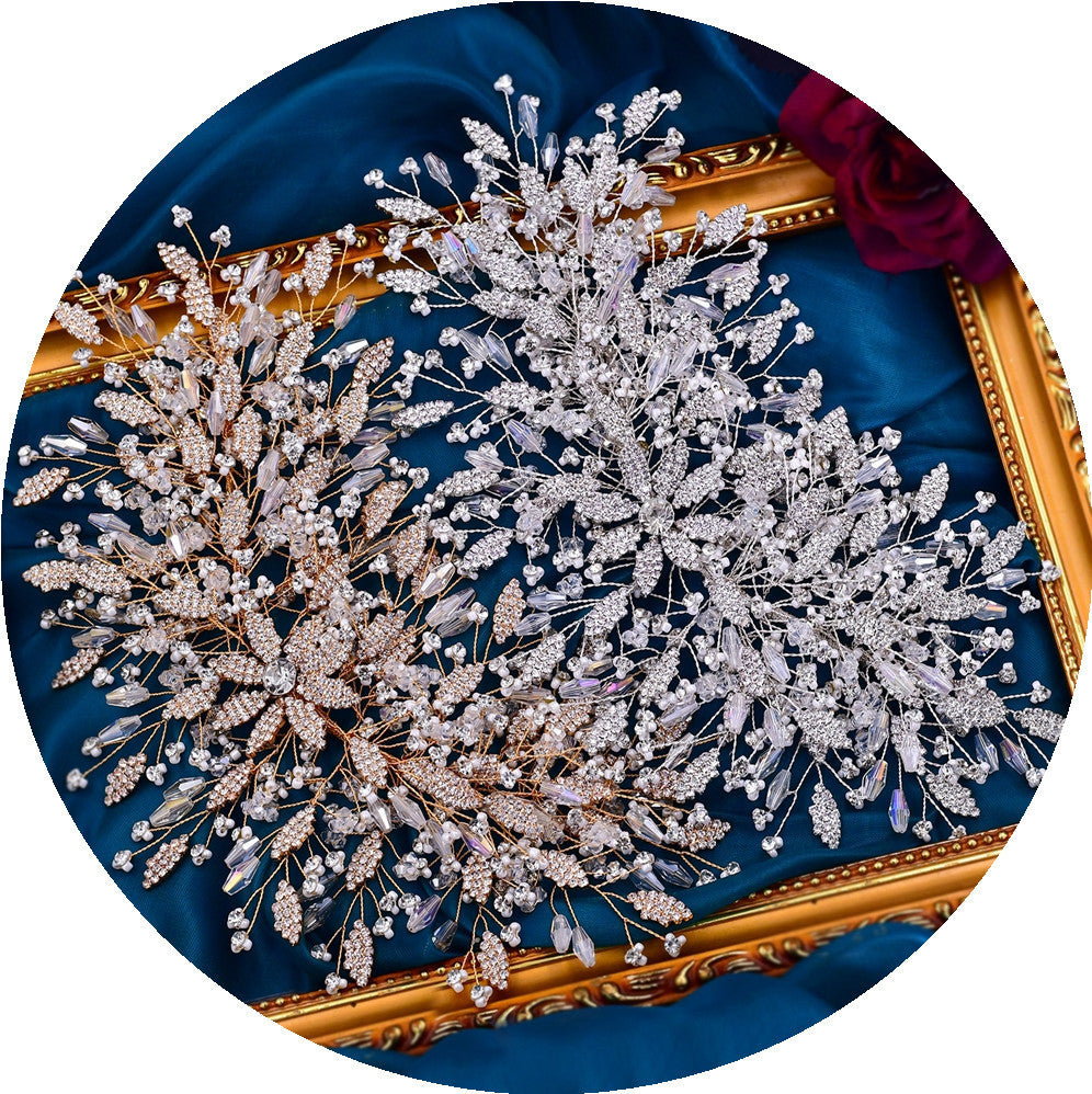 Decorative wreath with pearls and crystals on a blue fabric background