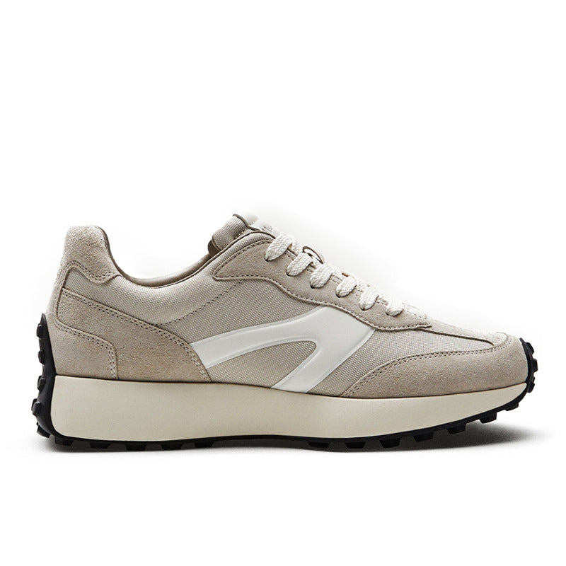 Beige sneaker with white accents on a white background