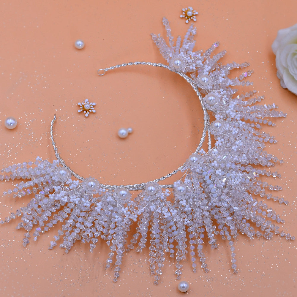 Delicate silver necklace with pearls on a peach background