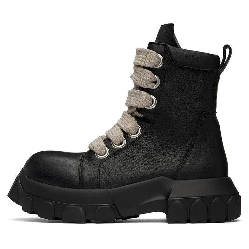 Black leather boot with gray laces on a white background