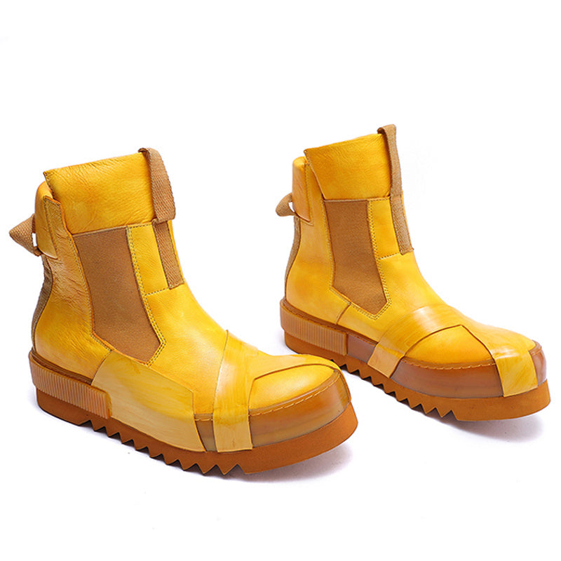 Pair of yellow and brown boots on a white background