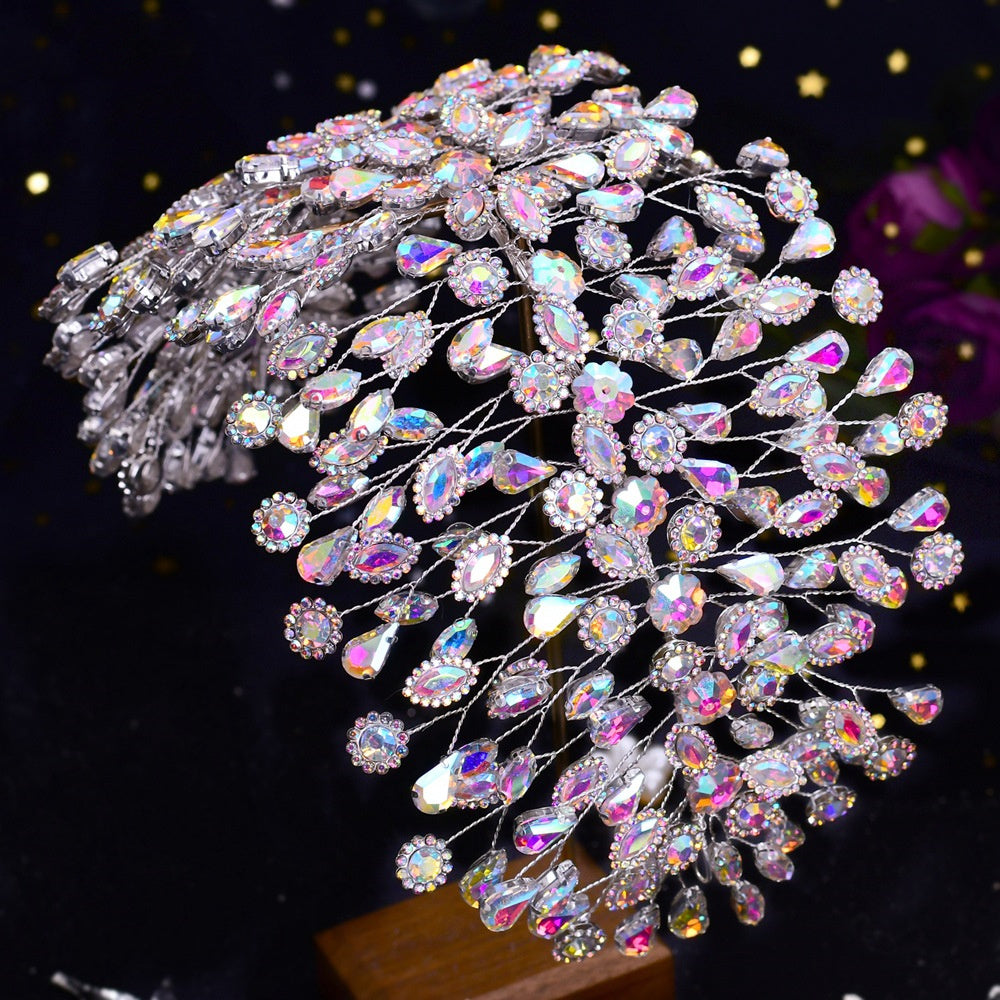 Sparkling crystal hairpin with multicolored gemstones on a dark background
