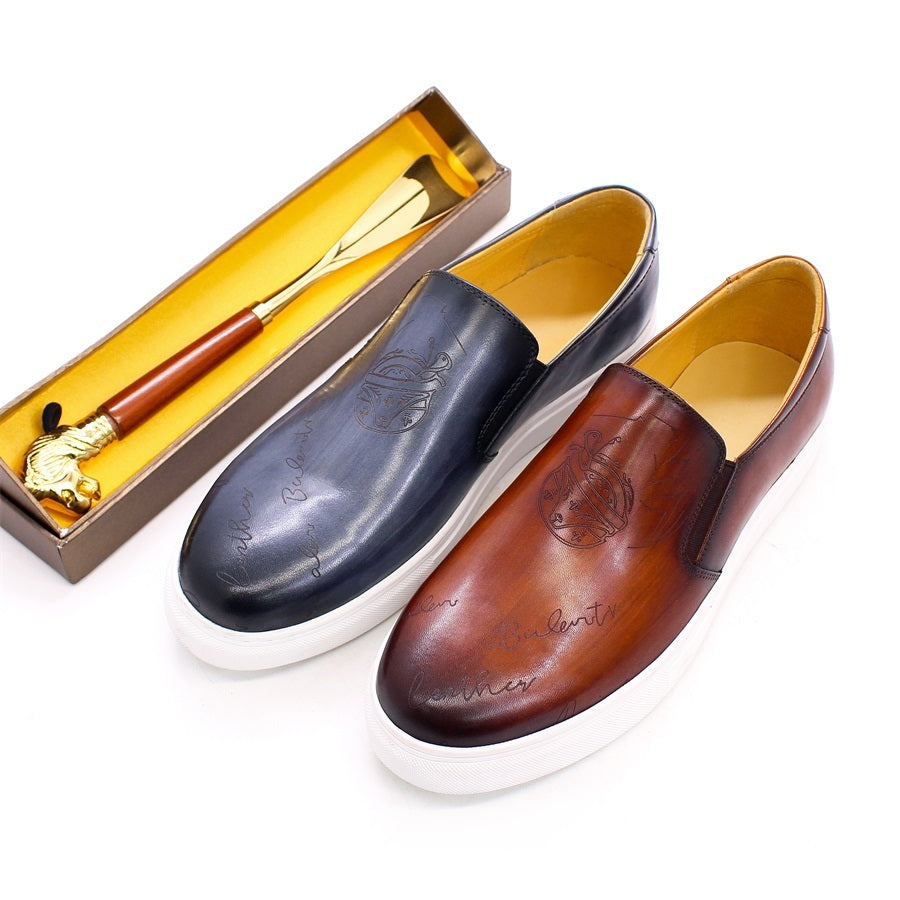 Two leather shoes, one brown and one black, with a shoe shine kit in the background.
