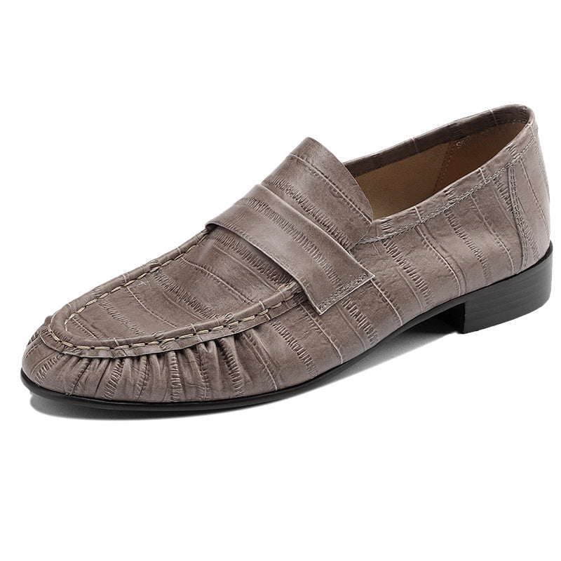 Brown loafer shoe on a white background