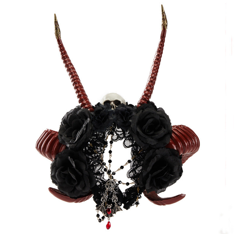 Decorative headband with black roses, red ribbons, and a skull on a white background