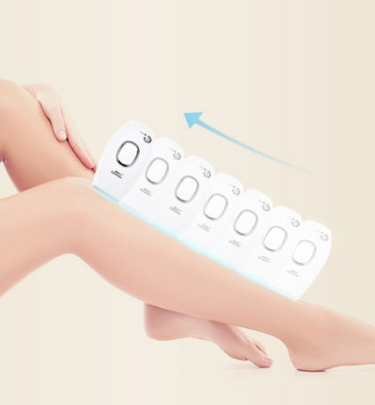 Electric razor with digital display on a person's leg against a light background