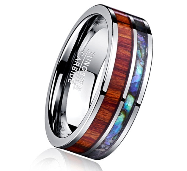 Tungsten carbide ring with wooden and abalone shell inlay on a white background