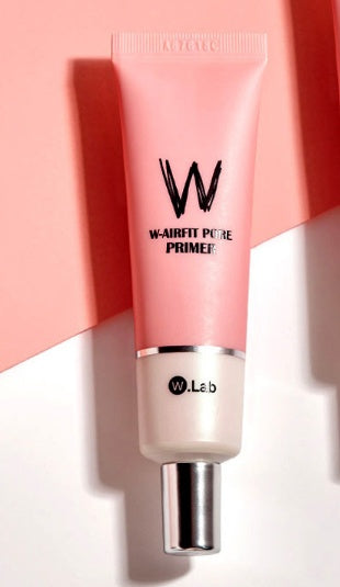 W-Lab primer bottle on a pink and white background