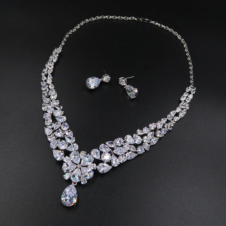 Jewelry set with a necklace and earrings on a black background