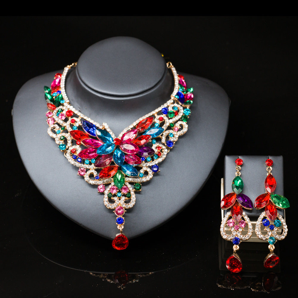 Colorful jewelry set with necklace and earrings on a black background