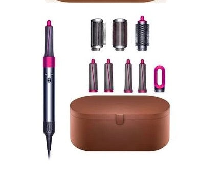 Hair styling tool set with a brown case, multiple attachments, and a pen-like device on a white background.