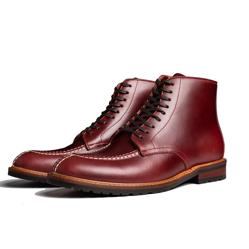 Pair of maroon leather boots on a white background