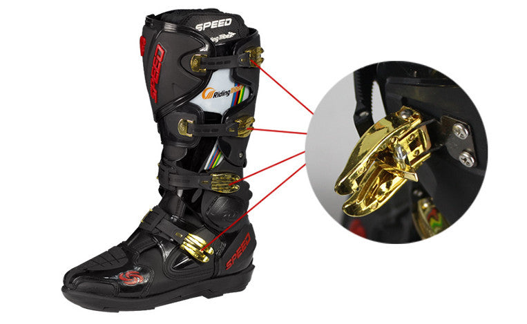 Black motocross boot with gold fastening mechanism on a white background