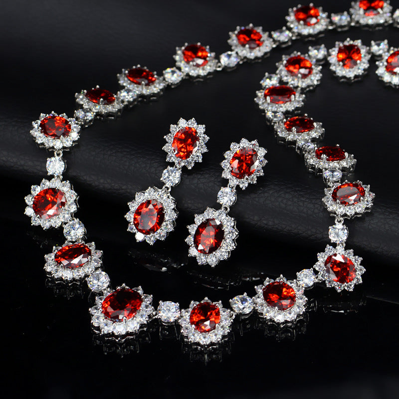 Necklace with red gemstones and clear stones on a black background