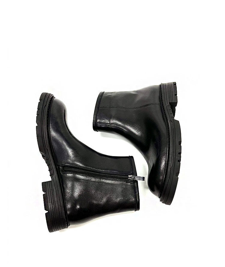 Pair of black leather boots on a white background
