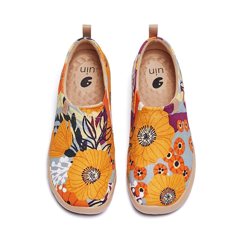 Colorful floral-patterned shoes on a white background