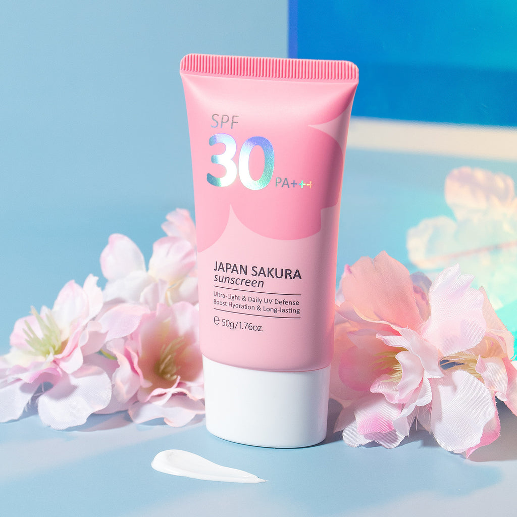 Pink sunscreen tube with SPF 30 on a blue background with flowers