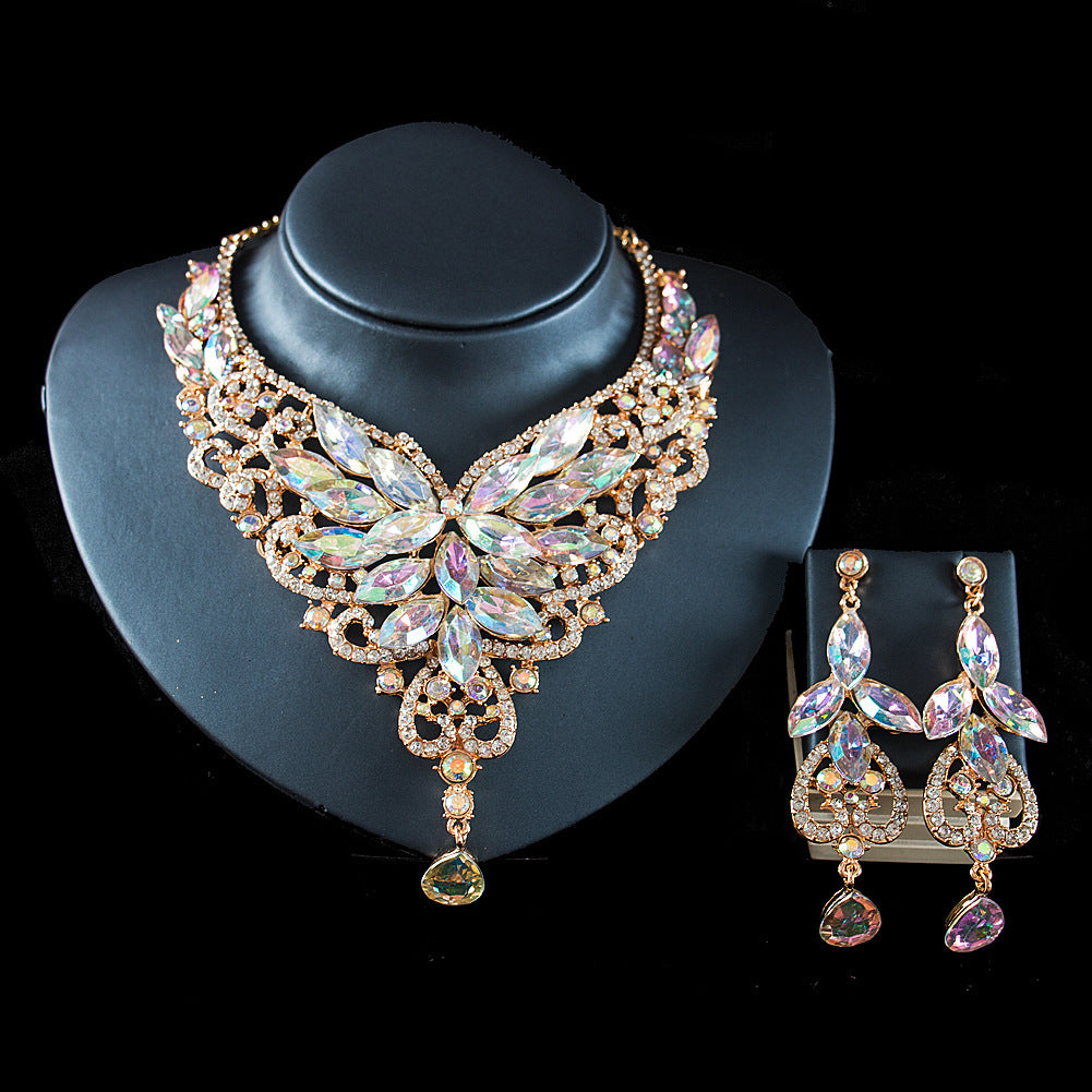 Jewelry set with necklace and earrings on a black stand