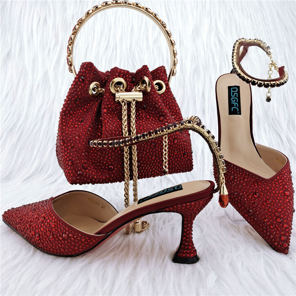Red studded handbag and high-heeled shoes on a white background