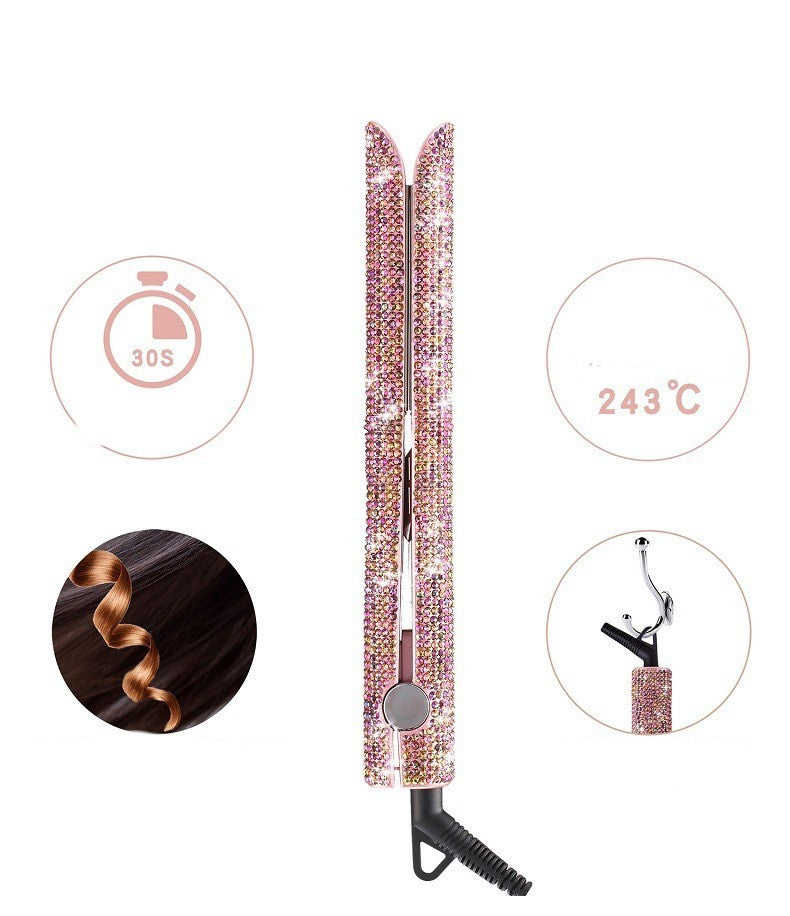 Pink hair straightener with decorative elements on a white background