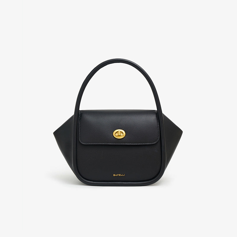 Black handbag with a gold clasp on a white background