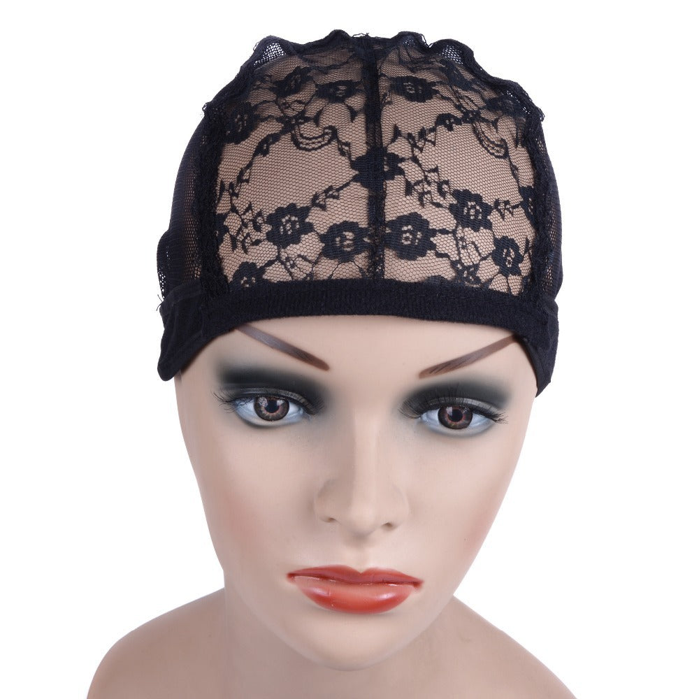 Black lace cap on a mannequin head with makeup against a white background
