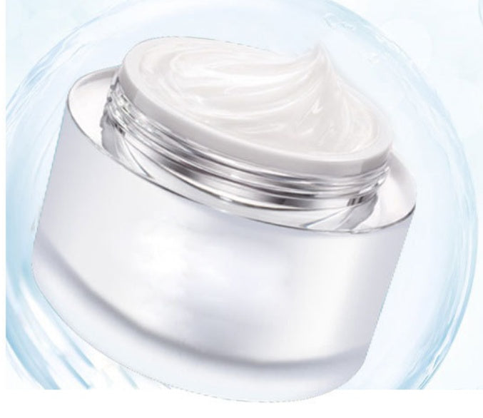 Clear jar of cream with a white lid on a light blue background