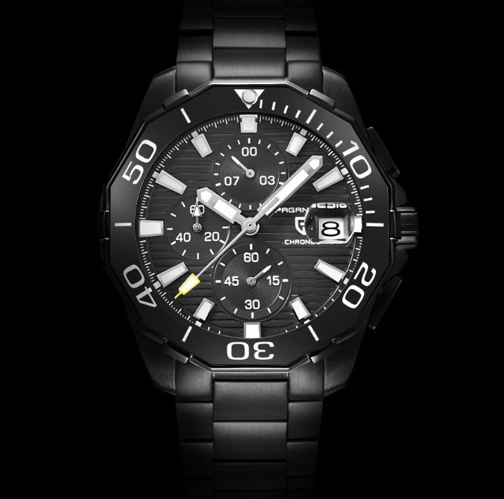 Black wristwatch with detailed face on a black background