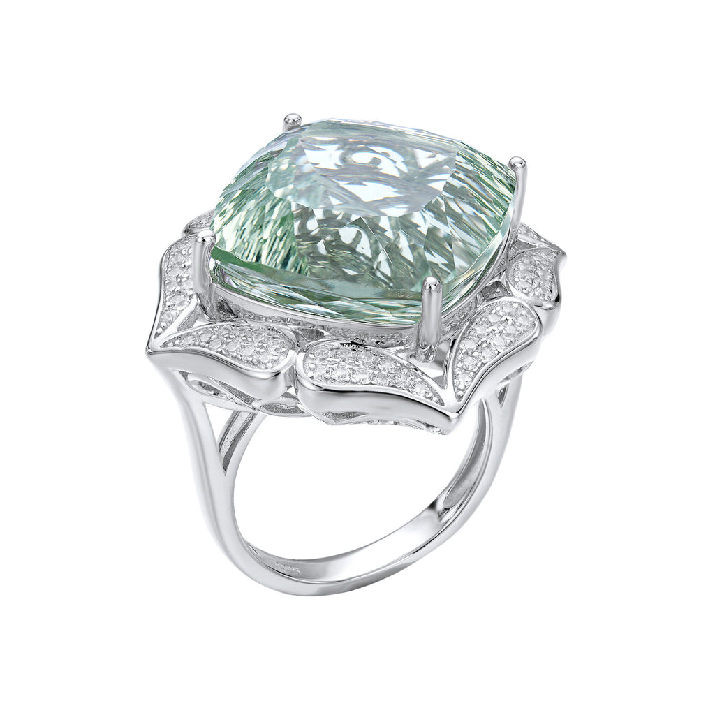 Ring with a large green gemstone and diamond-studded band on a white background