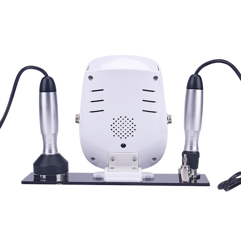 White dental milling machine with two attachments on a white background